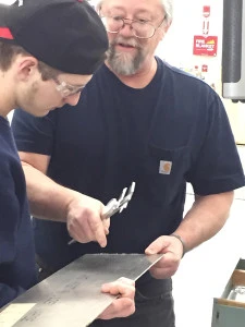 Nate & Mr. Bersing selecting materiel