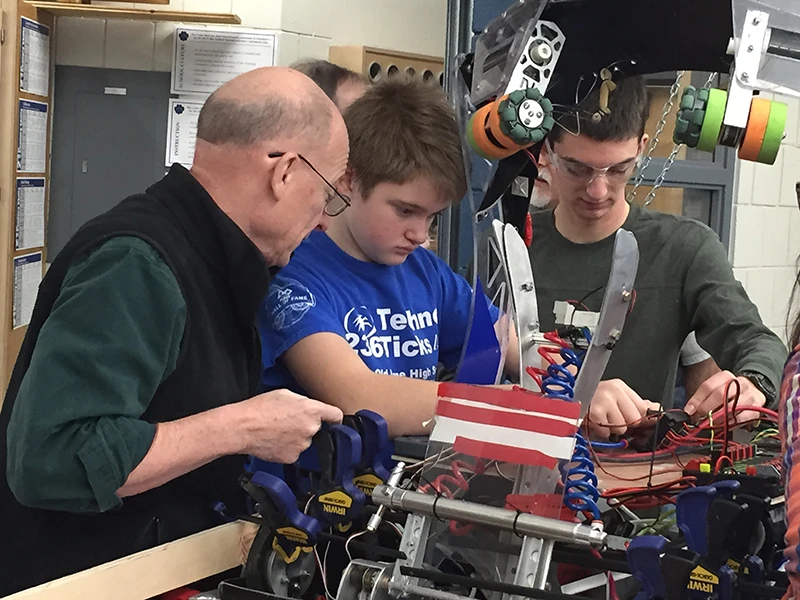 Mr. Borden, Matt, Jared checking out the wiring on 2014 bot