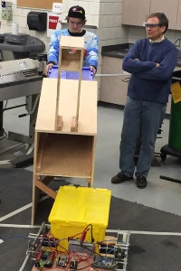 Mr Wilczinski testing boxes through the chute