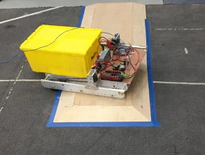 Moving the chassis over the  scoring zone
