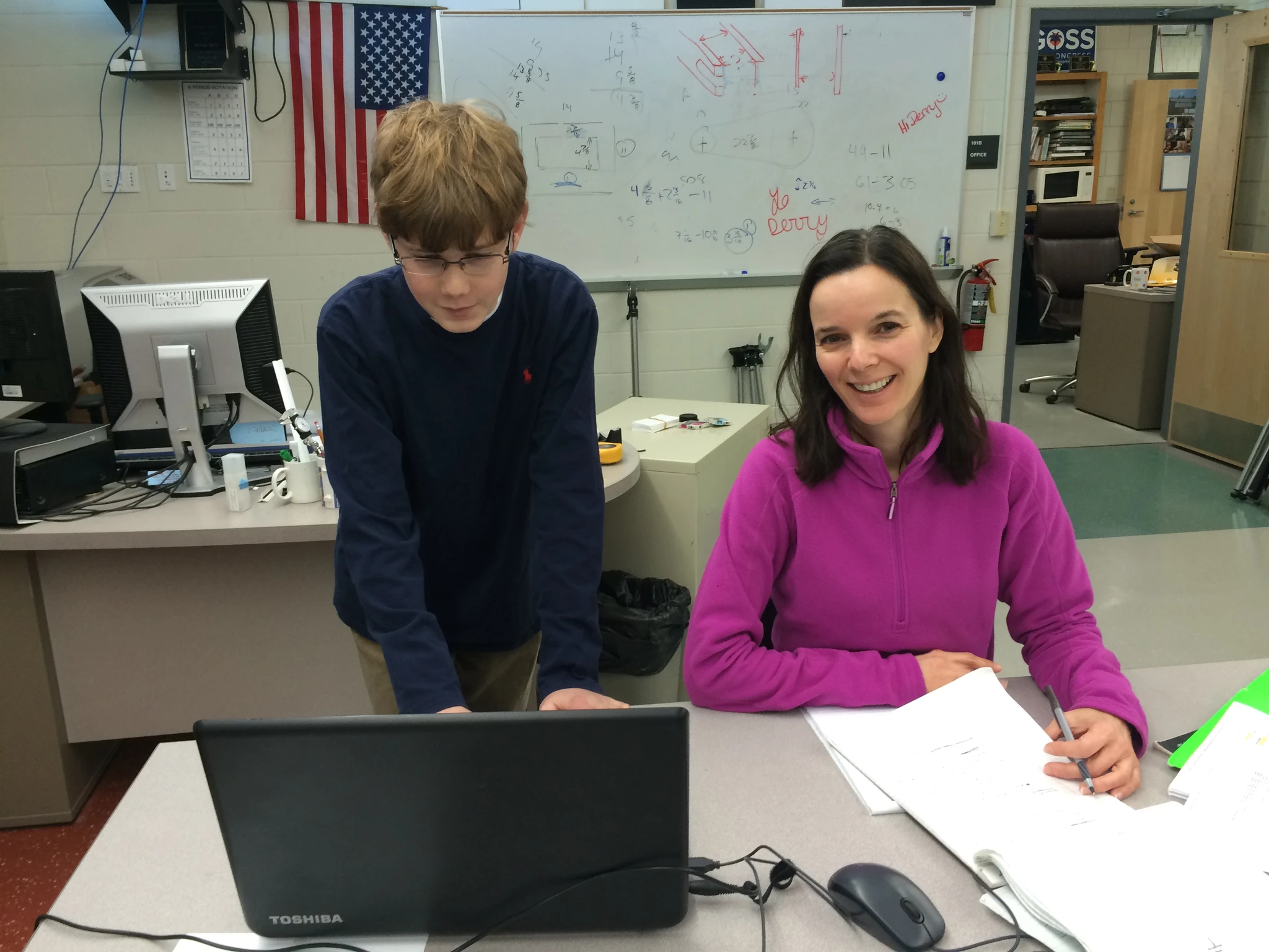 Gabrielle works with Mrs Di Carlo on formatting the code.