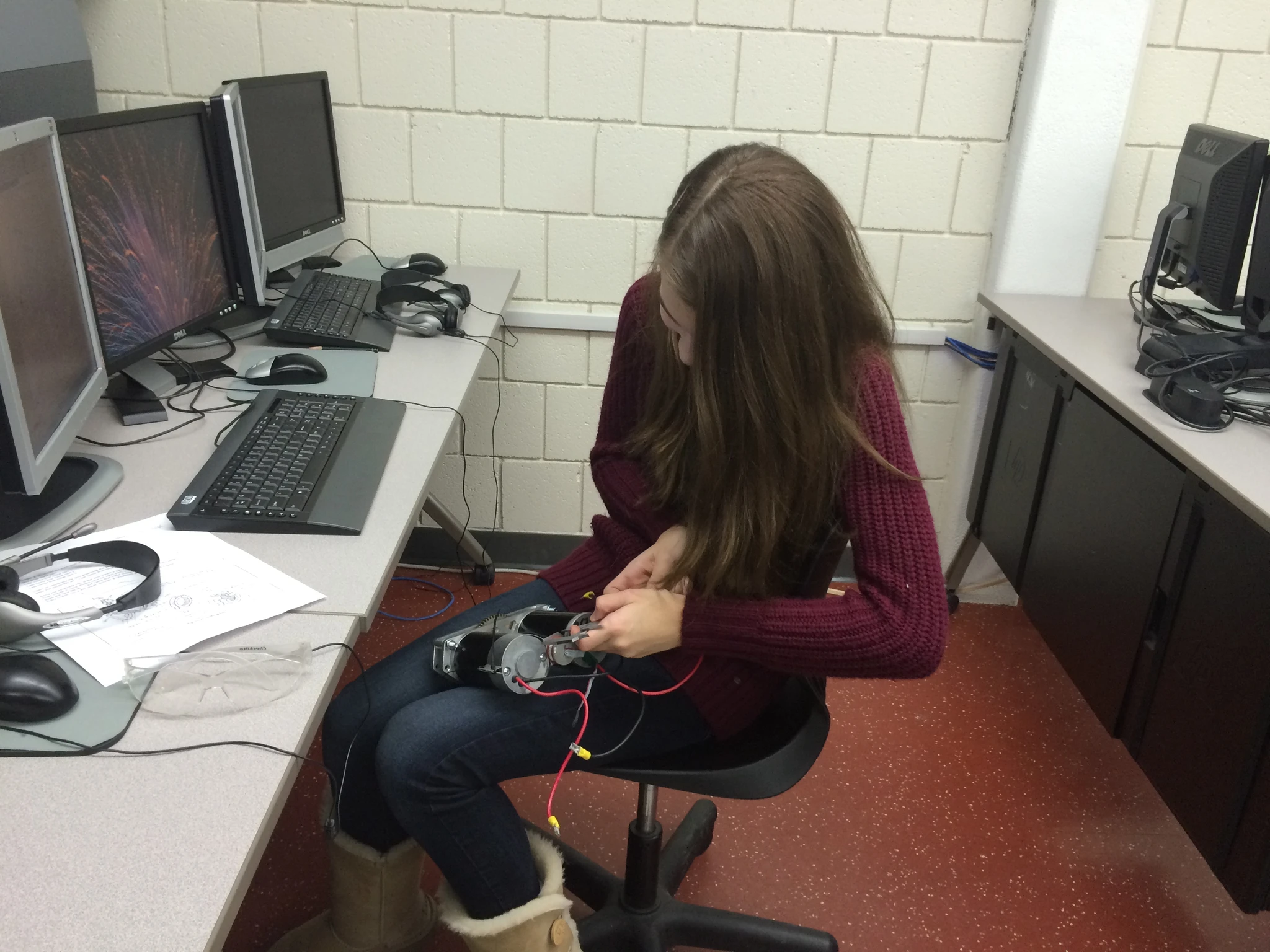 CAD Laura Lee measures the encoder bracket