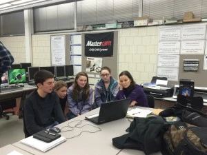 Jared gives the programming group a lesson - Sophie, Avery, Shanon, Alexis as they start to write the code for the PID Elevator Control