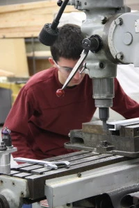 Jared working on finishing the ends of the elevator structural reinforcing arms