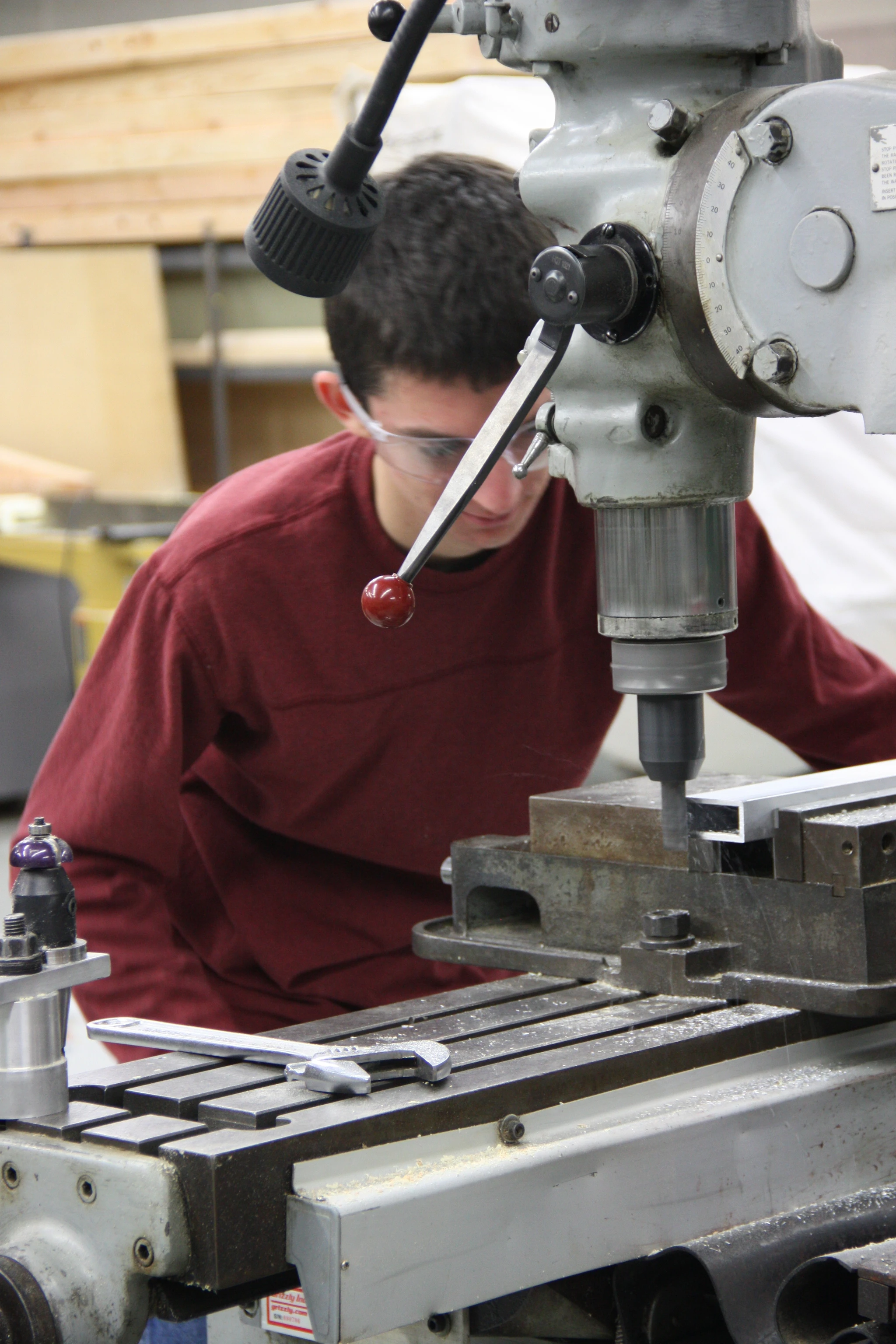 Jared working on finishing the ends of the elevator structural reinforcing arms