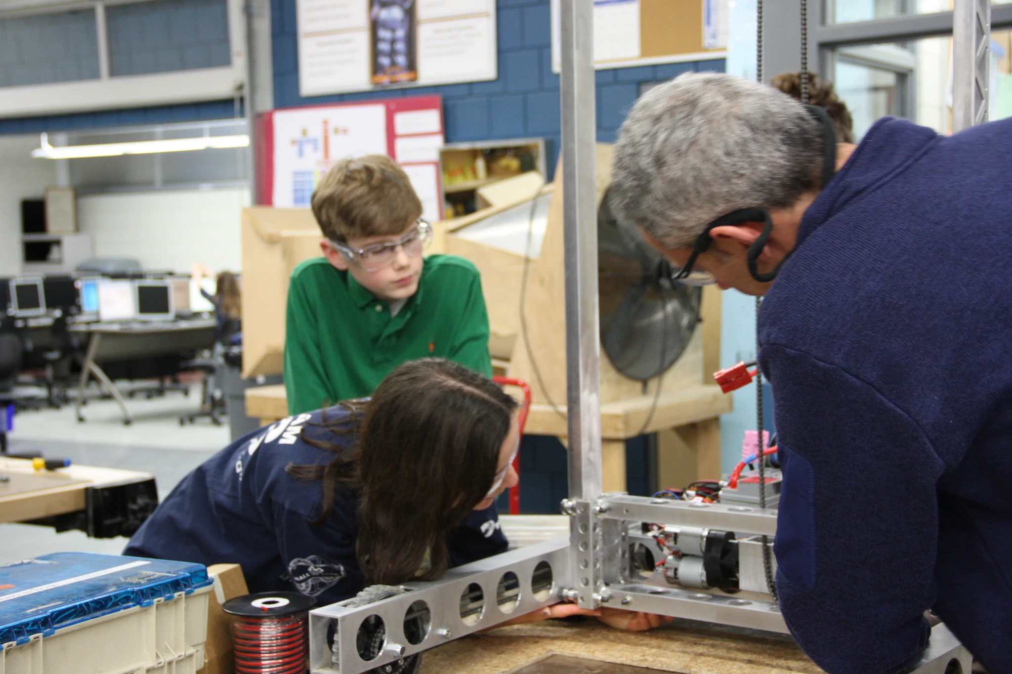 Gabriel working with Mr Derry and Mrs DiCarlo on the limit switch