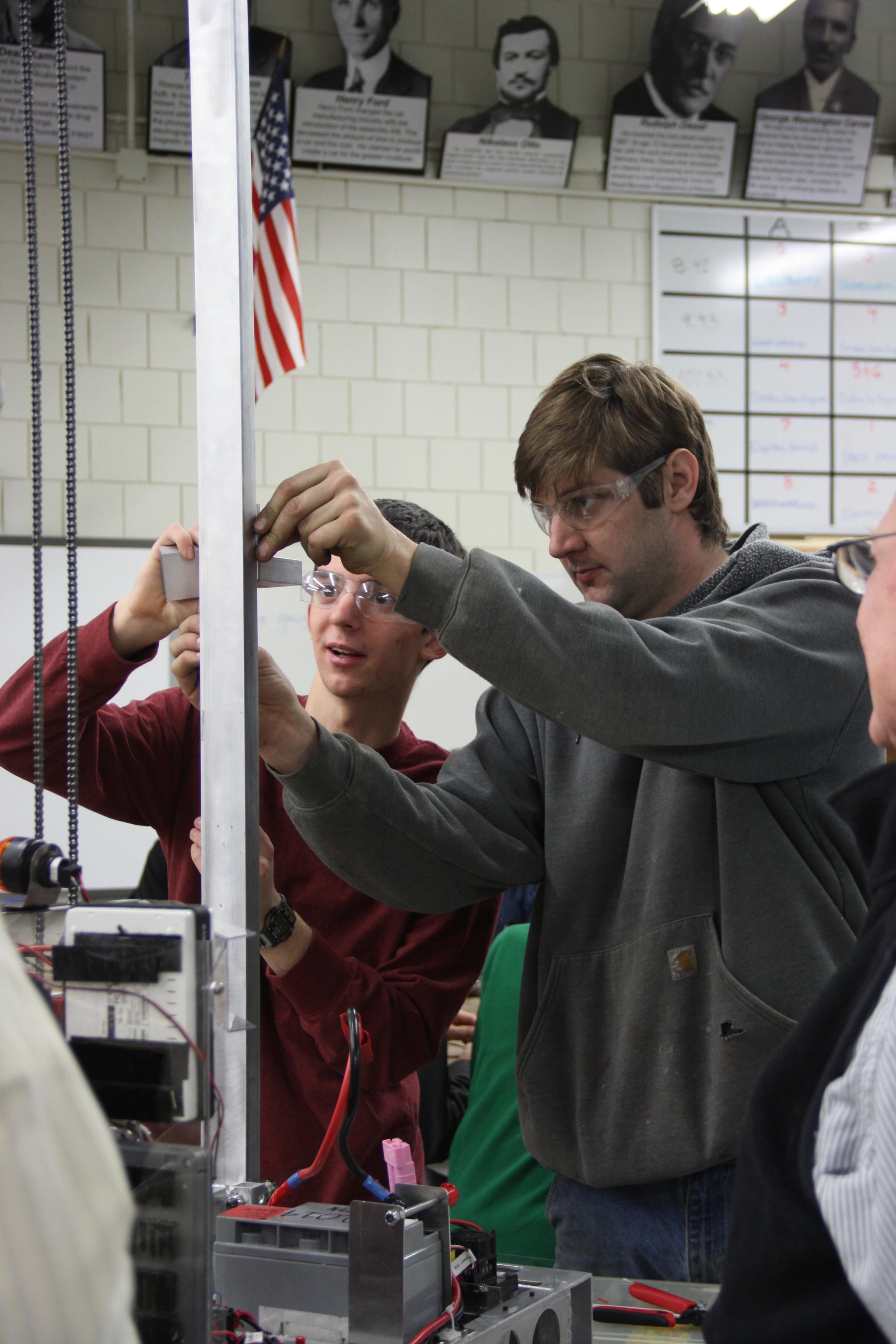 Jared and RJ work on the elevator