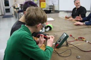 Gabrielle and Nate work on wires for the limit switch